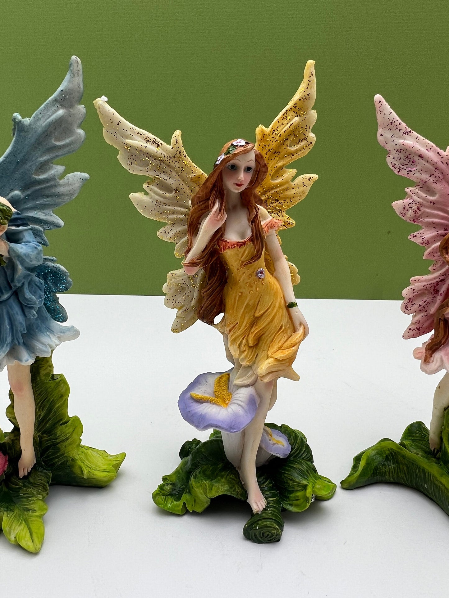 Glitter Fairies Standing on Flowers