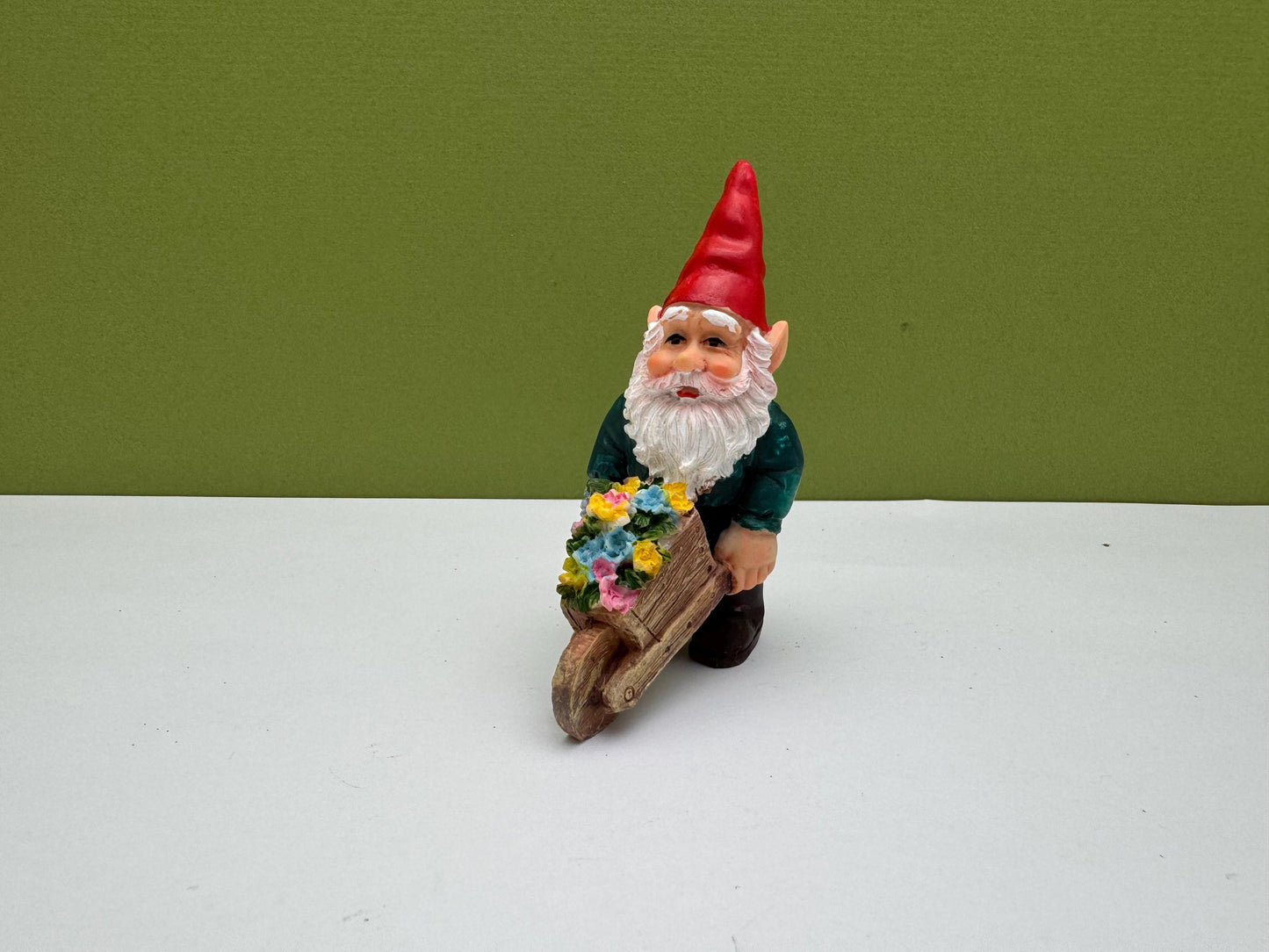 Gnome Holding Wheelbarrow