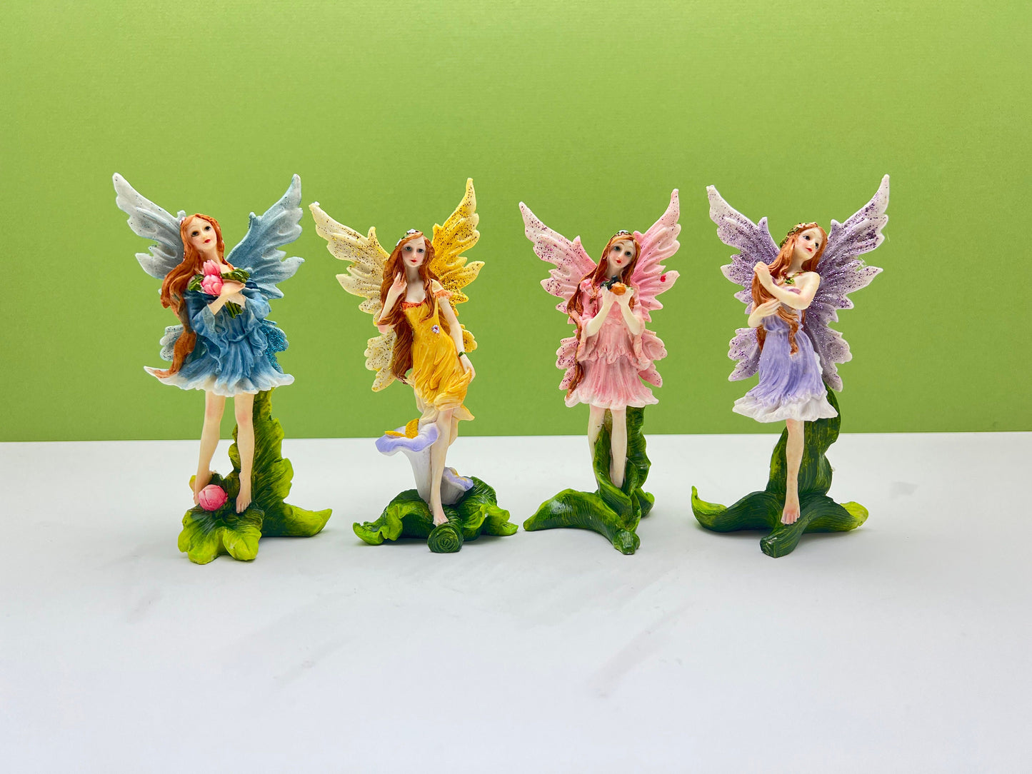 Glitter Fairies Standing on Flowers