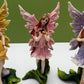 Glitter Fairies Standing on Flowers